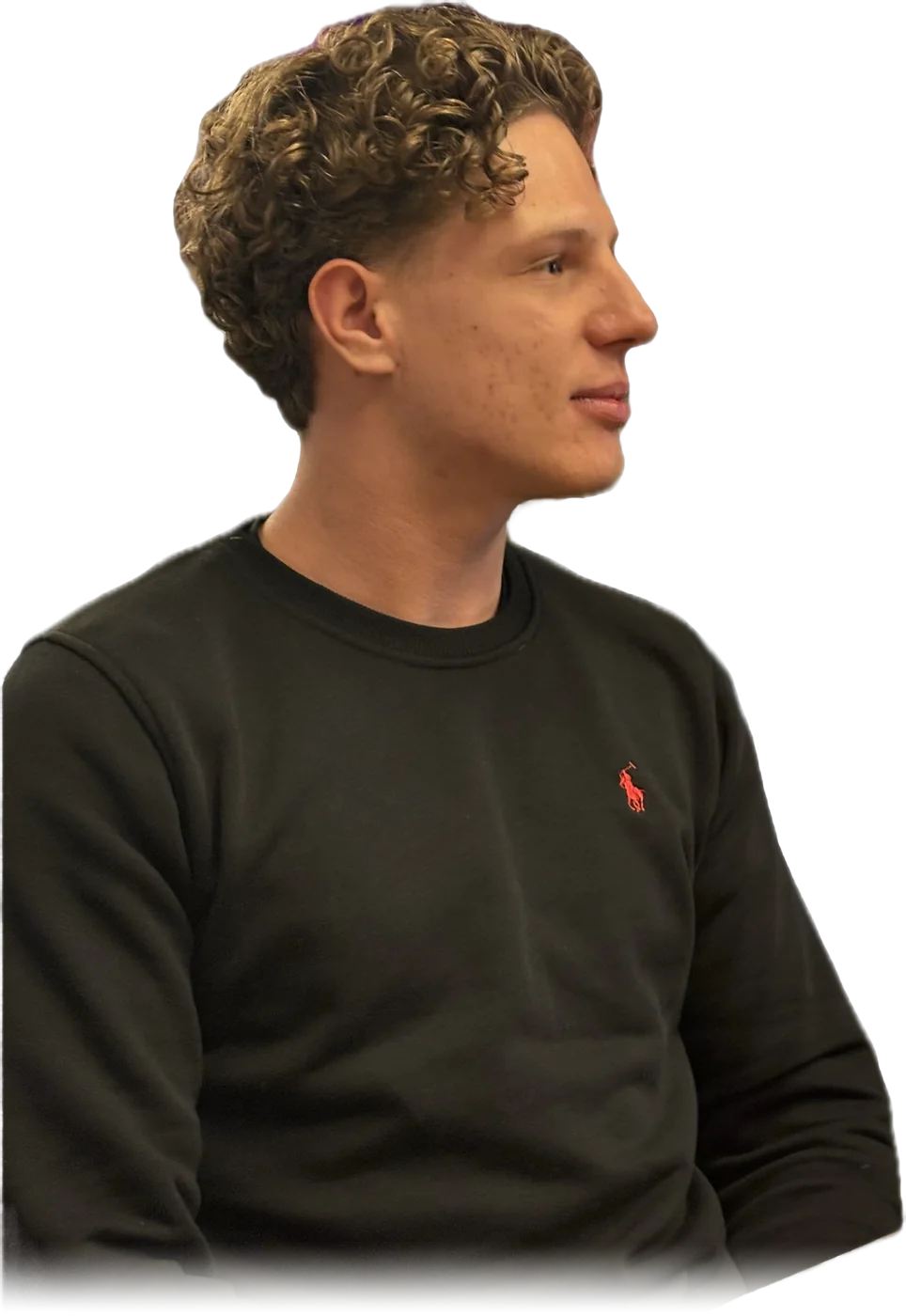 Portrait of Collin in a dark sweater, looking to the right